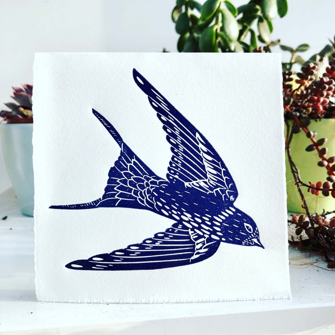 Swallows in flight hand printed lino cut greetings card by Claire Armitage
