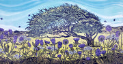 lino print of a hawthorn tree with wild flowers and blue sky.
